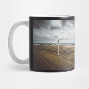 Aerial view of windmill against cloudy sky Mug